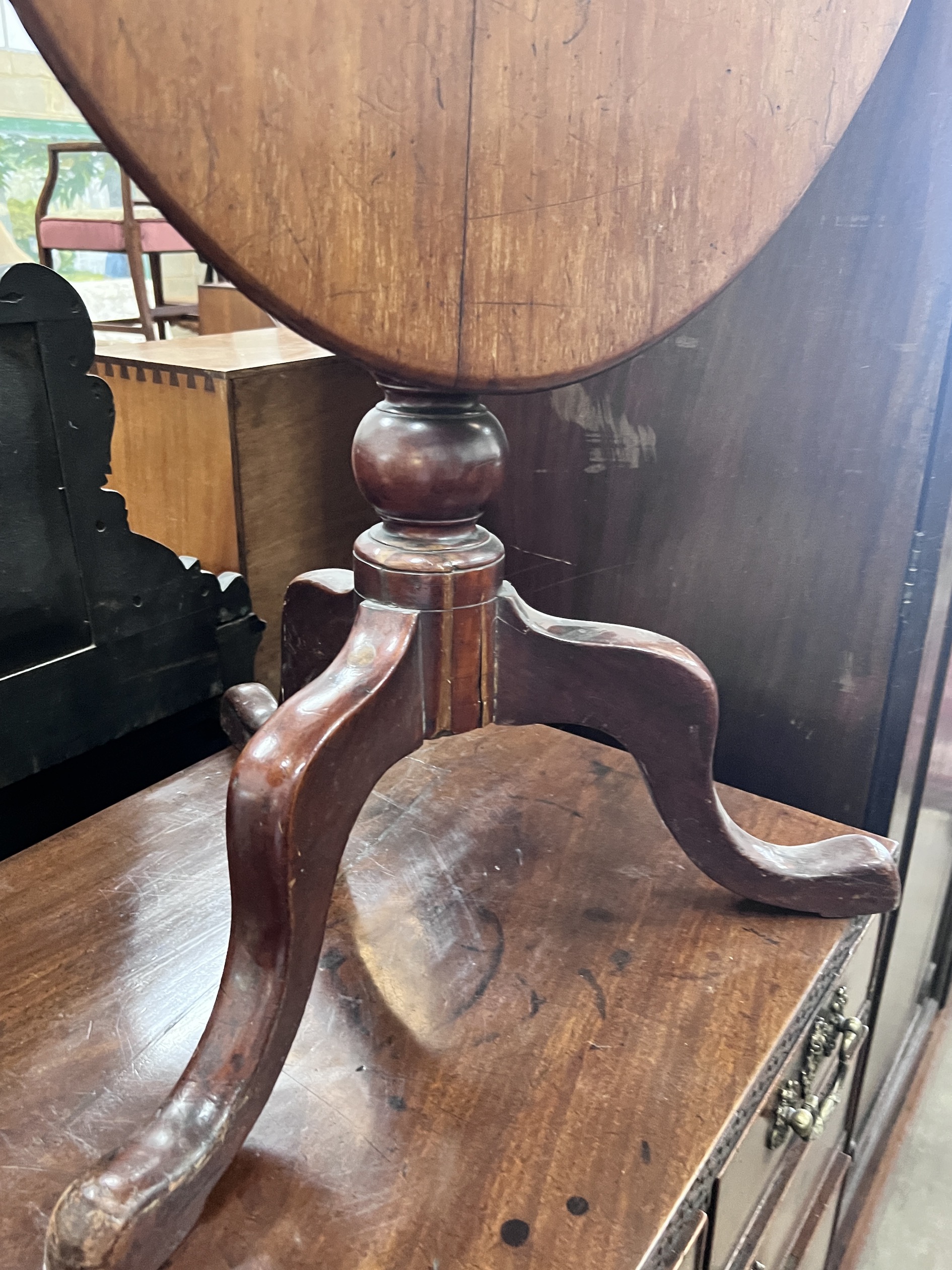 A Victorian spiral stem circular mahogany wine table, diameter 50cm, height 71cm, together with a Victorian oval mahogany tilt top tripod table